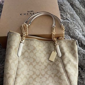 Women’s large tan and gold brand new bag